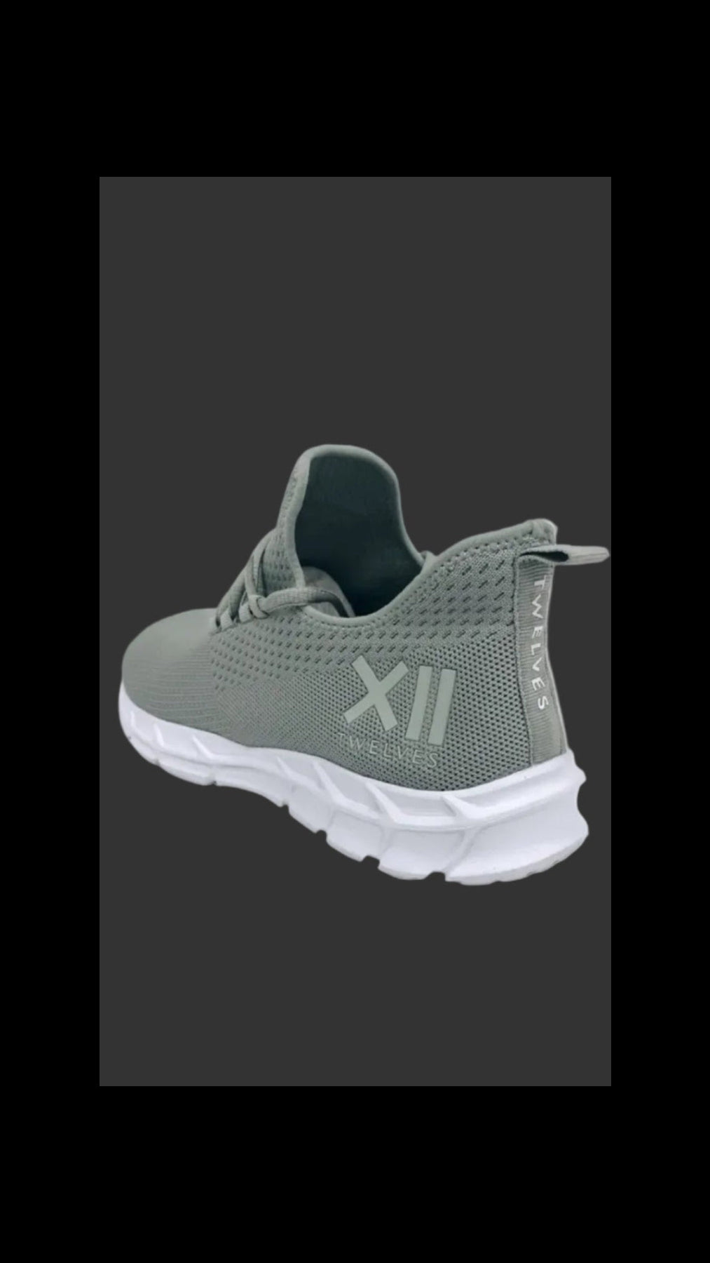 A Grey Twelves GTL Trainer with the logo visible on the heel
